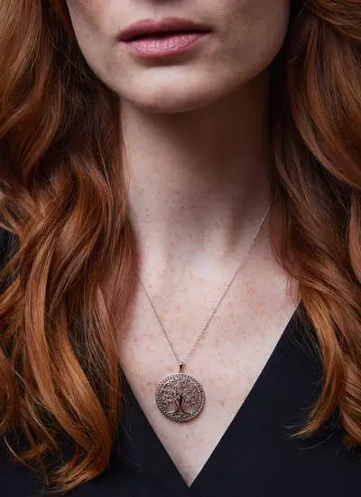 Close up shot of red haired woman wearing Sterling Silver Tree of Life Pendant
